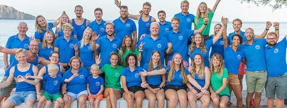 diving school crew with marine biologists in green
